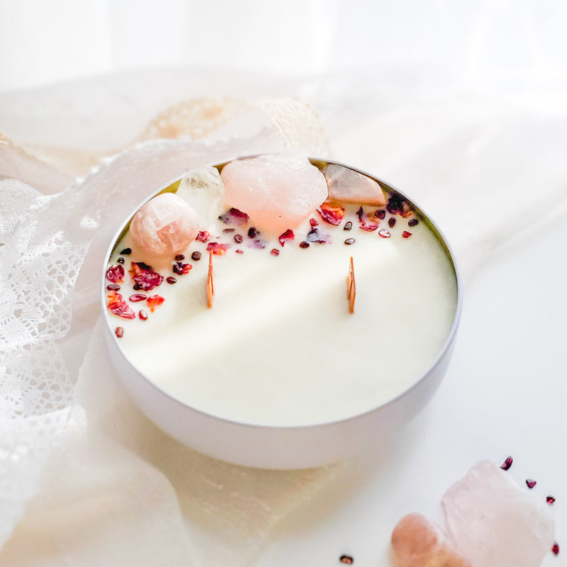 Love crystal candle with Rose Quartz, Peach Moonstone, Pink Calcite, Garnet, Clear Quartz, two wood wicks, and Rose petals in white metal vessel - Tuberose and Frangipani - Floral scent
