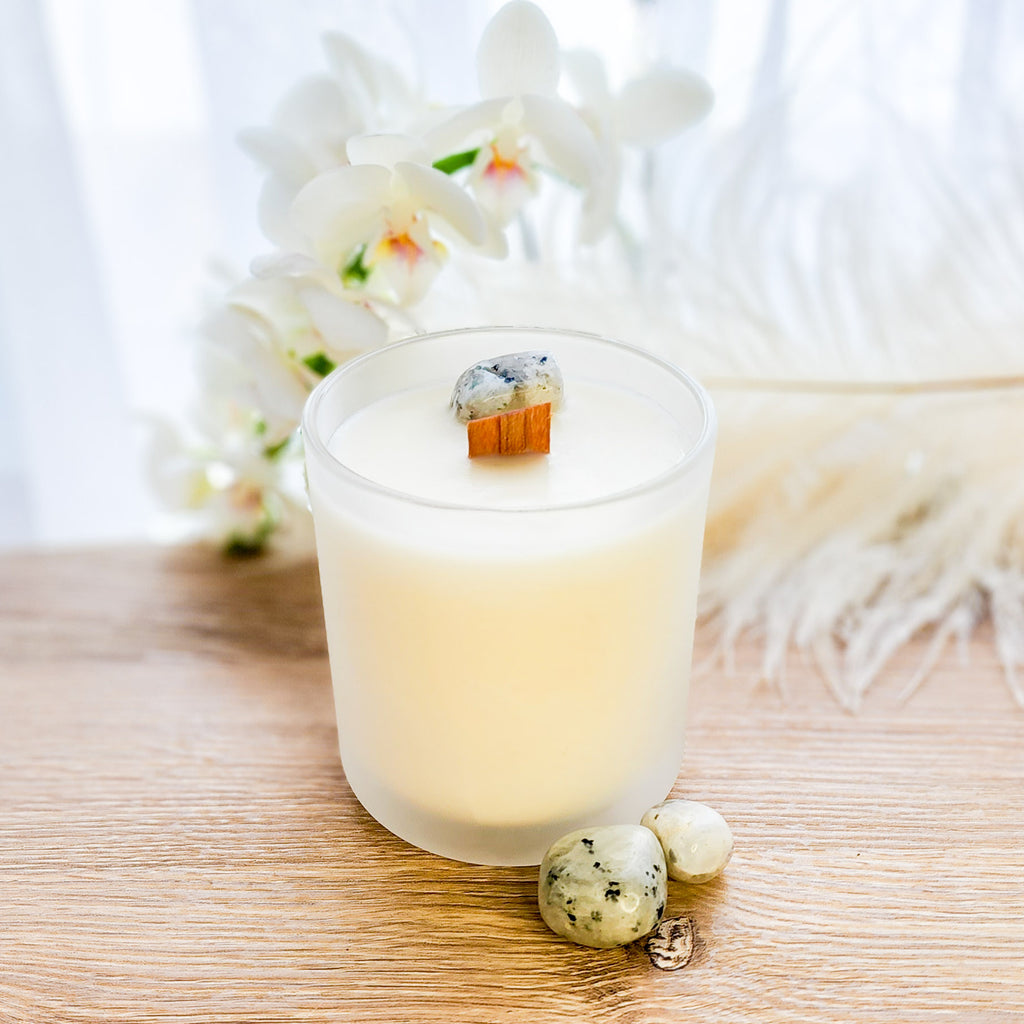 Moonstone Crystal Candle in frosted white glass vessel.  Orchid and Vanilla with Wooden wick