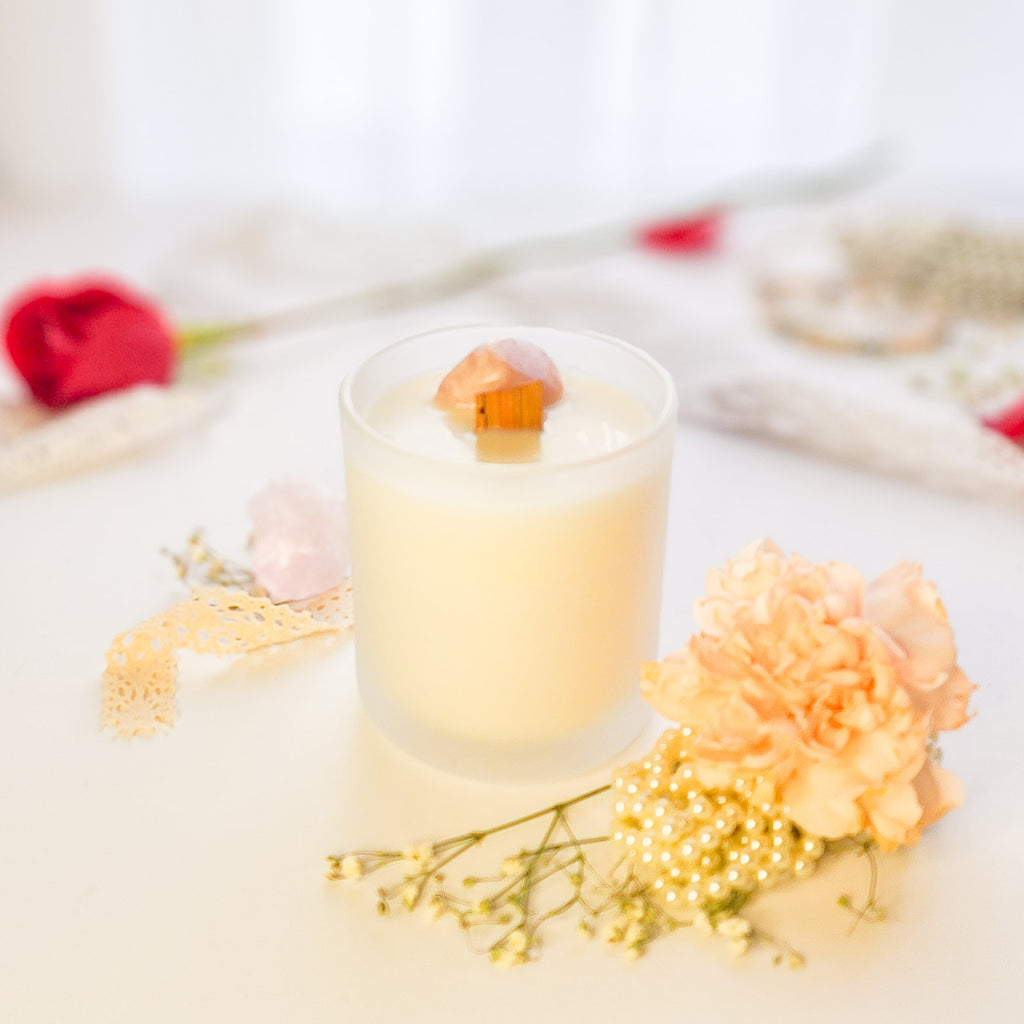 Pink Calcite crystal candle with wooden wick in white vessel - Tuberose and Frangipani floral scent