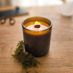1 wooden wick  lit candle in amber glass jar - Oakmoss and Cedar