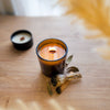 1 wick candle in amber glass jar, scented with 100% natural essential oil fragrance blend Palo Santo and Sage. Used for purification.