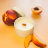 Tangerine and Peach Tea candle in white metal tin, with wooden wick - Orange backgound with peaches